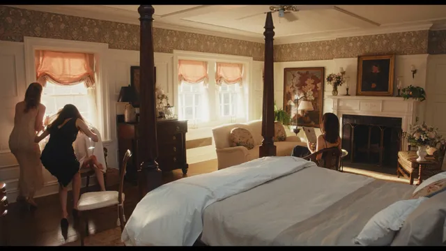 Sarah Pidgeon appearing barefoot beside a bed in a screen capture.