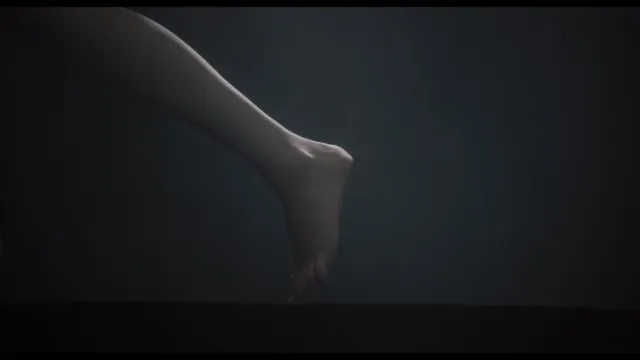 Léa Seydoux floating underwater in a dramatic scene.