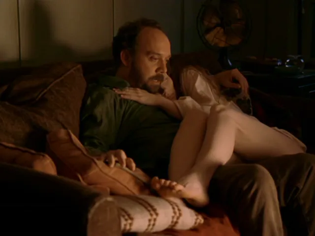 Bryce Dallas Howard reclining beside a companion during a screen scene.