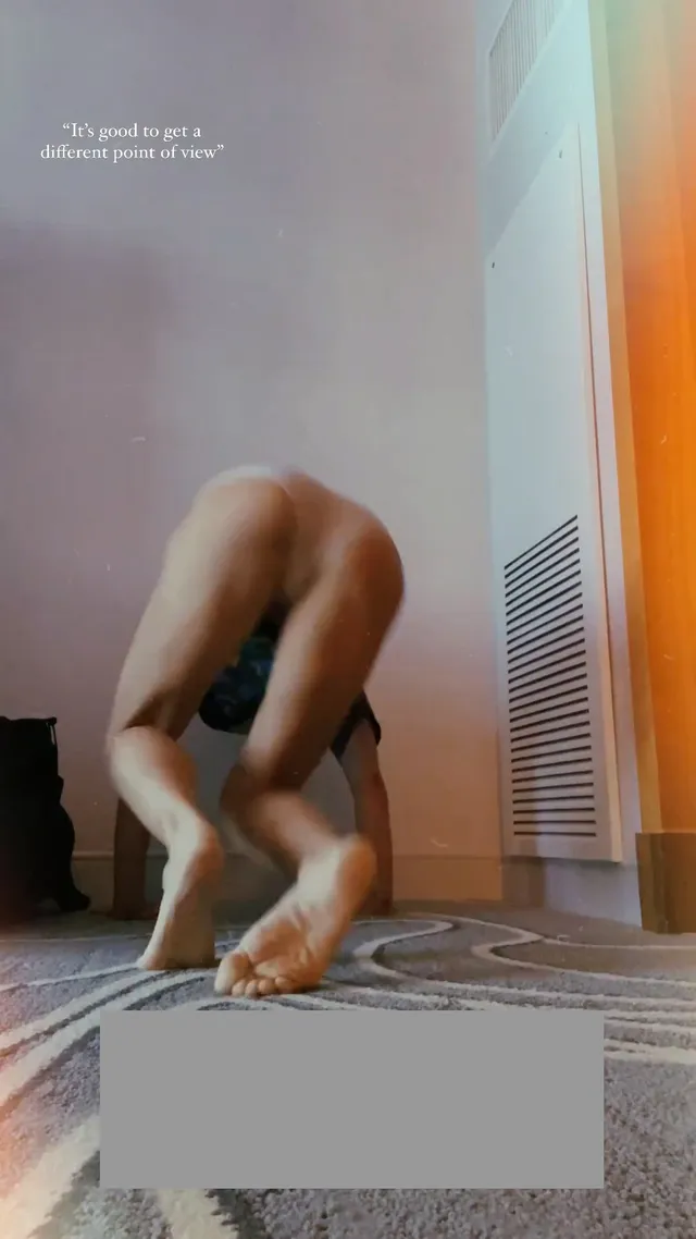 María Gabriela de Faría exercising barefoot on a floor mat.