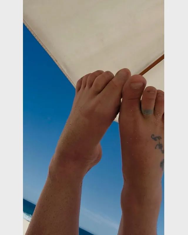 Britney Spears a close-up of bare feet with a small tattoo.
