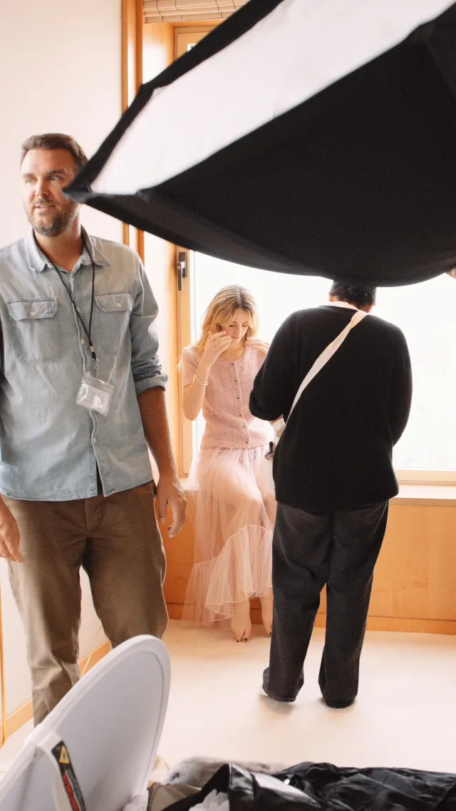 Grace Van Patten wearing a pale pink gown during a studio shoot.