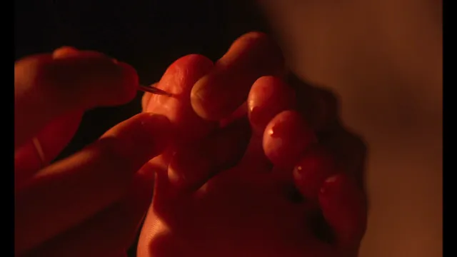 Eva Green a dimly lit close screen detail of toes.