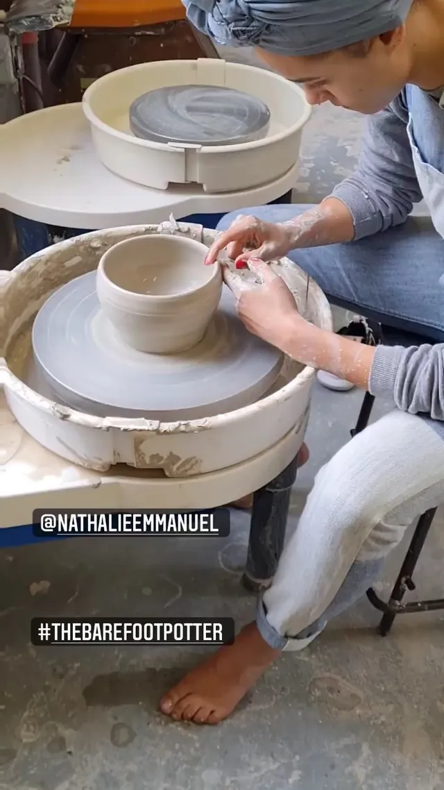 Nathalie Emmanuel sitting at a pottery wheel.