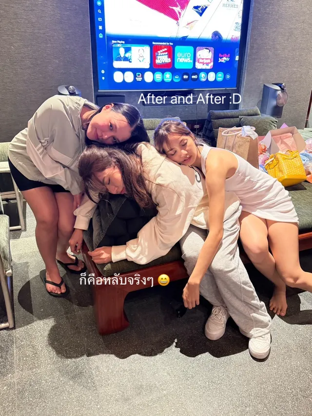Lisa (Lalisa Manobal) posing beside companions in light footwear and casual clothing indoors.