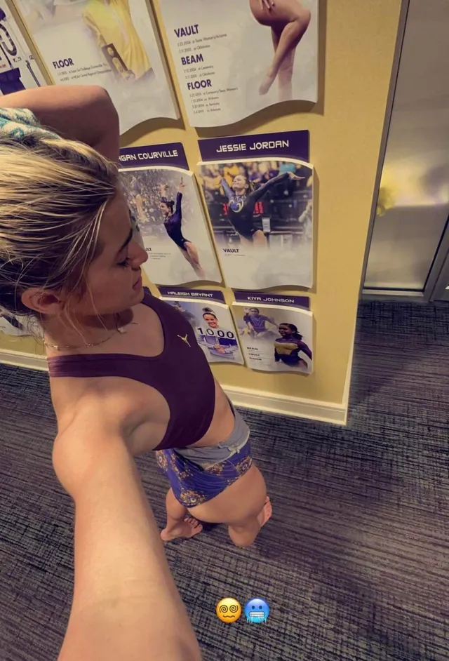Olivia Dunne taking a downward selfie inside a gym.