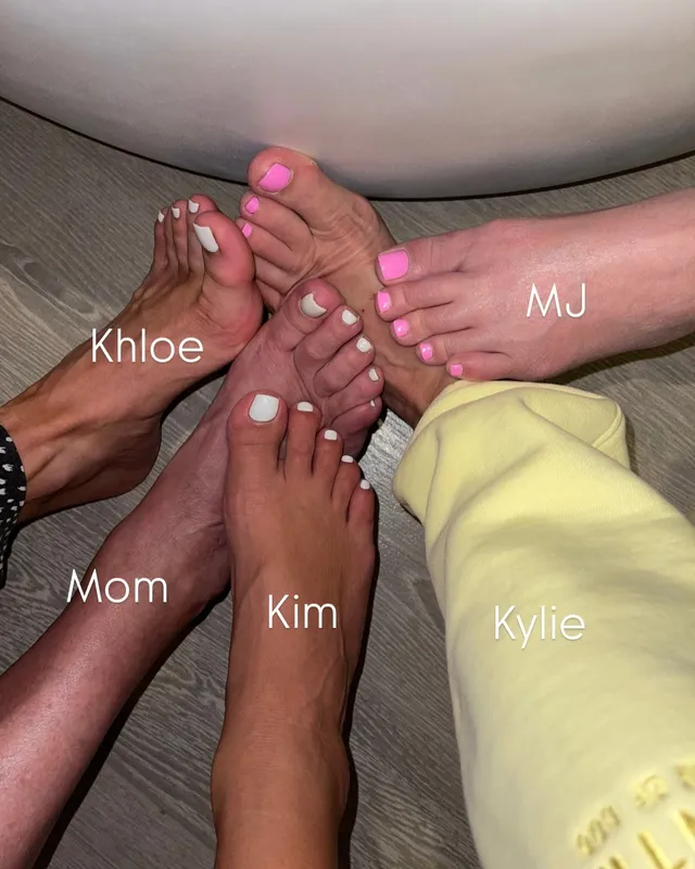 Kim Kardashian: close view of painted toenails with family members.