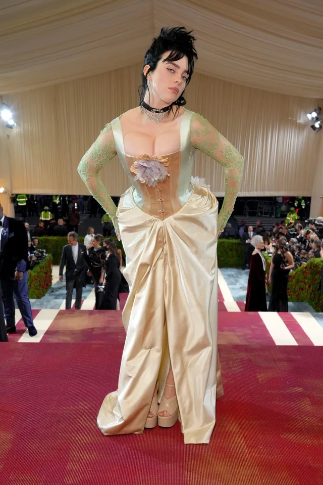 Billie Eilish a pale gown at a red-carpet event.