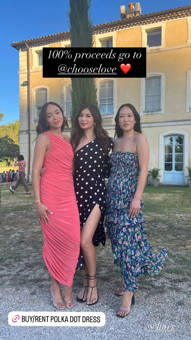 Gemma Chan standing with two friends outdoors.