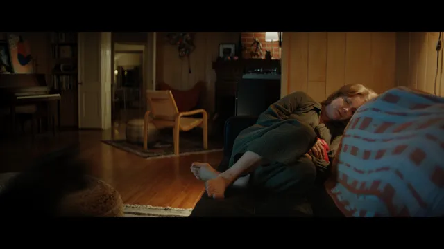 Amy Adams resting in a chair during a screen scene.