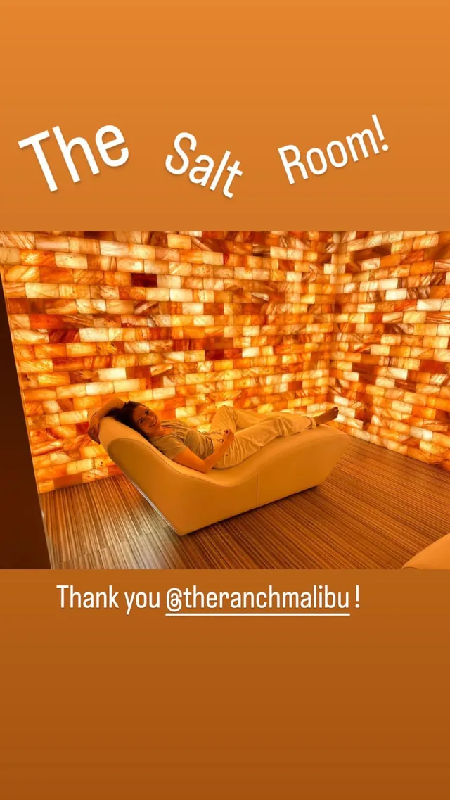 Hayley Atwell reclining in a glowing salt room.