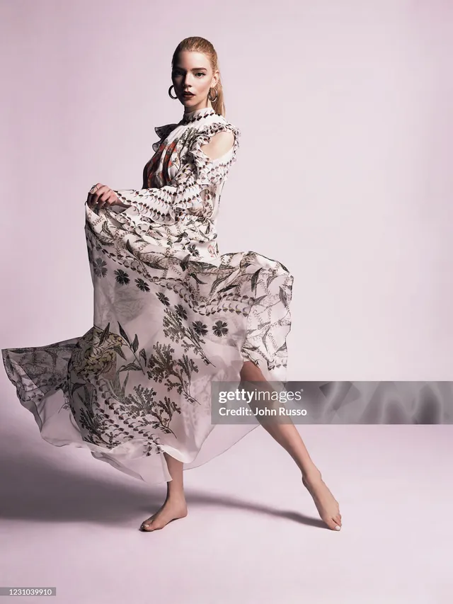 Anya Taylor-Joy wearing beige pointed heels with a patterned dress.