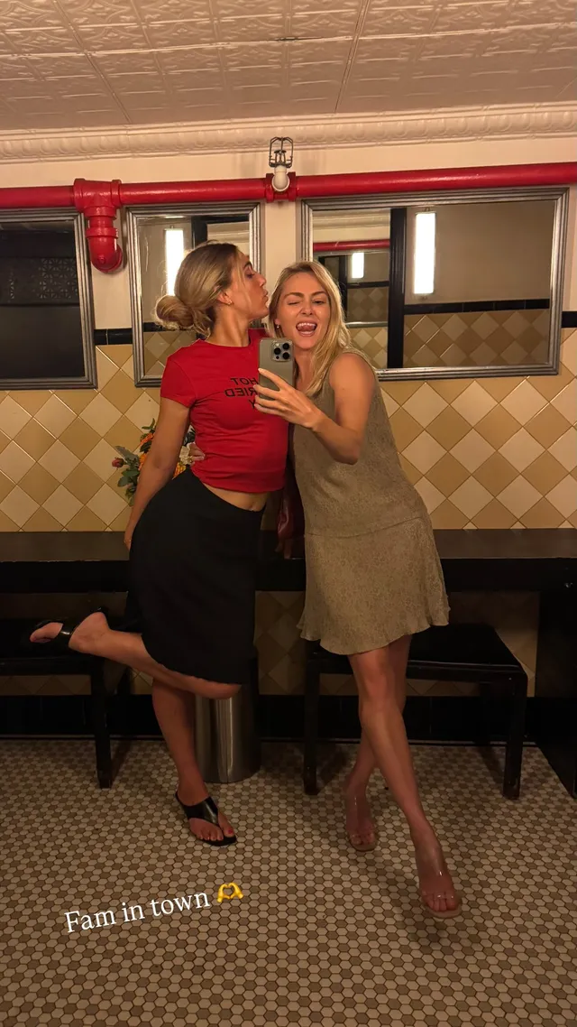 AnnaSophia Robb posing with a companion for a mirror portrait.