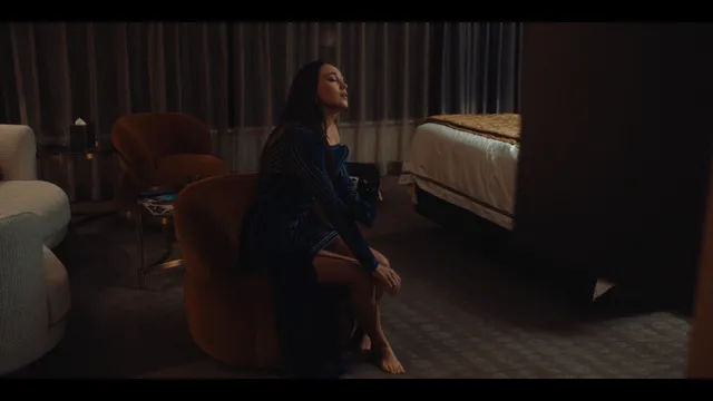 Alycia Debnam-Carey sitting indoors during a screen scene.