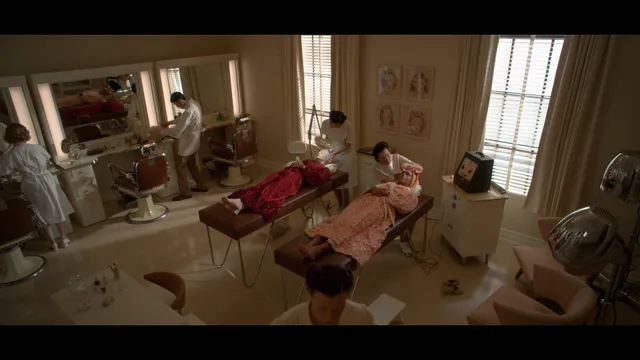 Samara Weaving reclining in an ornate room in a film scene.