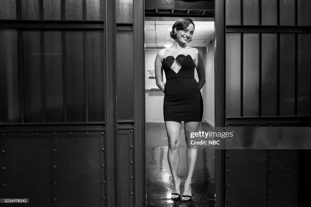 Chase Sui Wonders standing in heels during a monochrome television appearance.