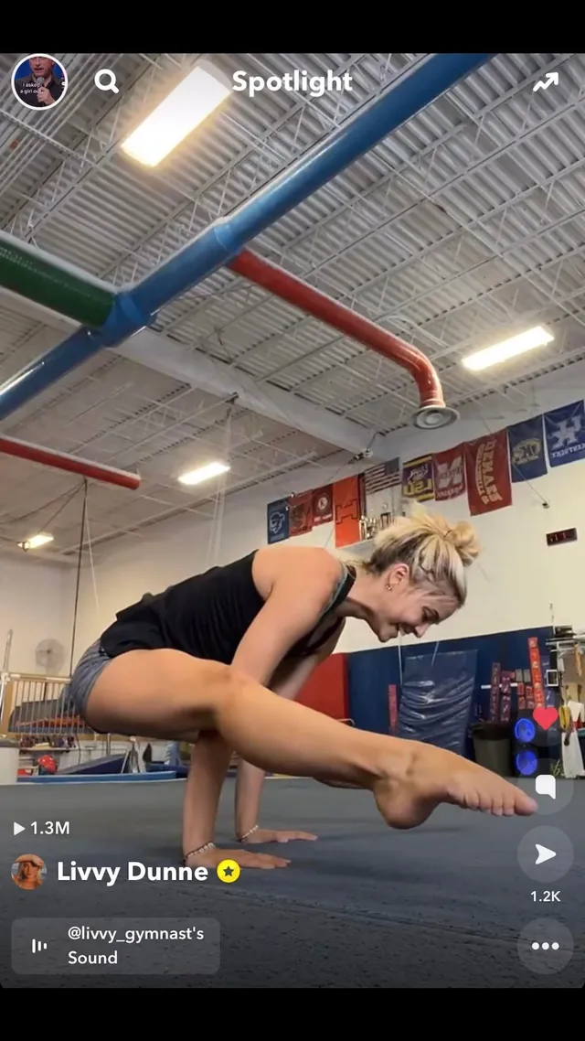 Olivia Dunne practicing gymnastics in a training gym.