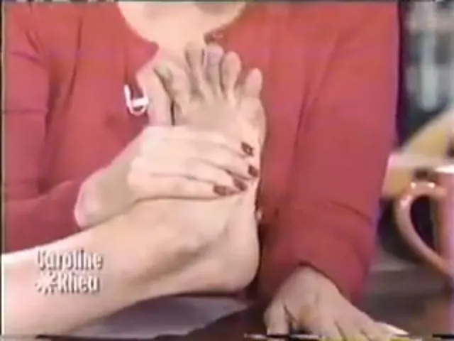 Brittany Snow showing her bare foot during a television appearance.