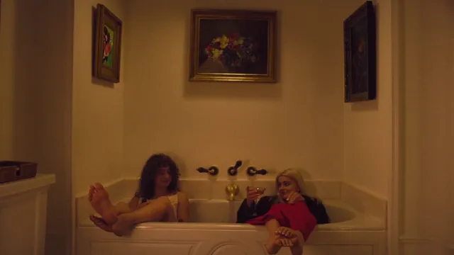 Ariel Winter resting in a bath during a screen scene.