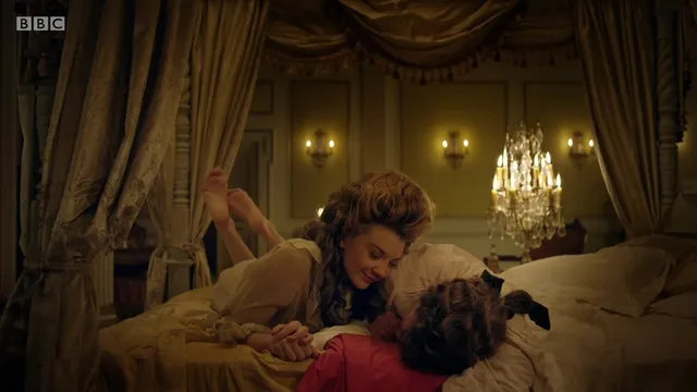 Natalie Dormer appearing in an ornate bedroom screen scene.