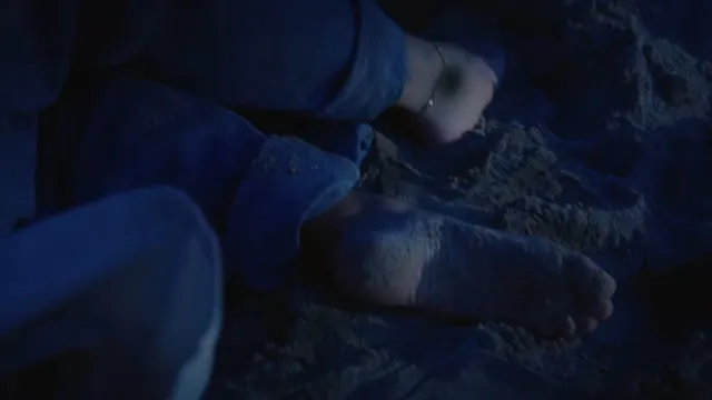 Mackenzie Ziegler appearing in a dark coastal screen scene.