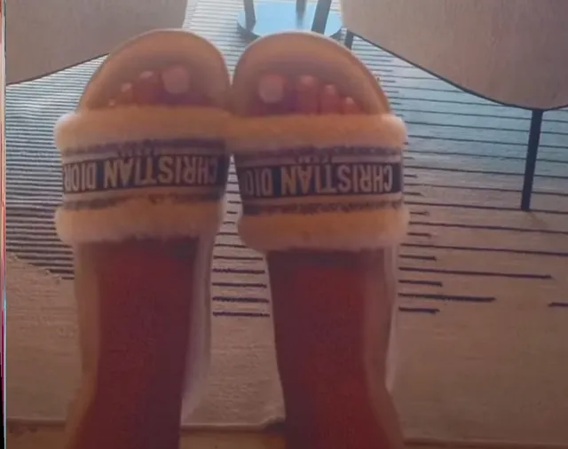 Iggy Azalea wearing pale open-toe slides.