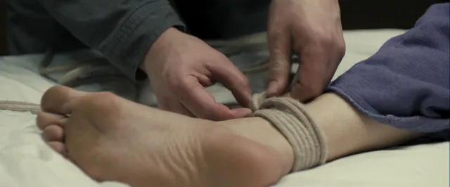 Gemma Arterton having an ankle binding loosened in a screen scene.