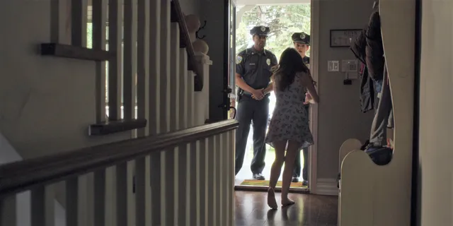 Anna Kendrick appearing in a scene near an open doorway.