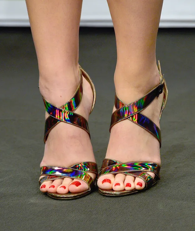 Katy Perry wearing colorful metallic heels.