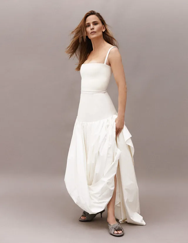Jennifer Garner posing for a studio portrait in a white dress.