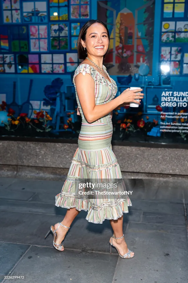 Chase Sui Wonders walking in a striped dress and clear heels.