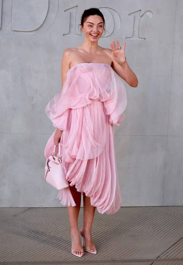 Miranda Kerr a pink event dress with pale heels.