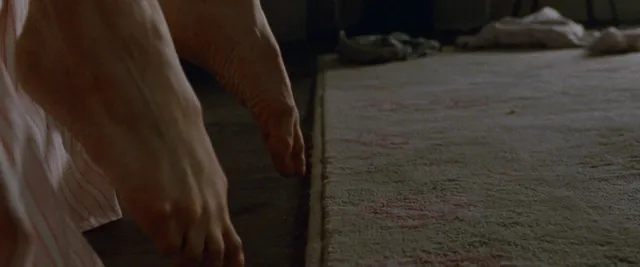 Natalie Portman resting bare feet in a screen scene.