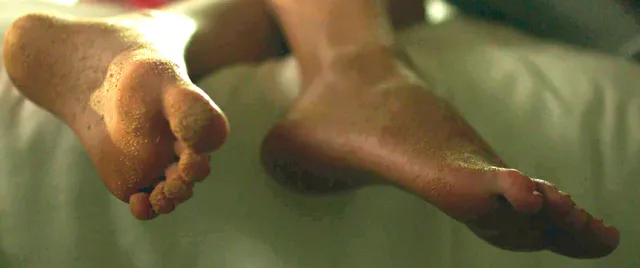 Claire Holt a close-up of bare feet during a screen scene.