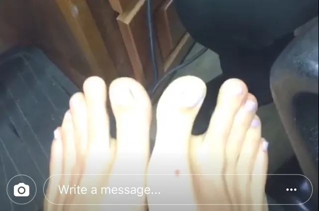 Alice Eve showing pale toenail polish after a pedicure.