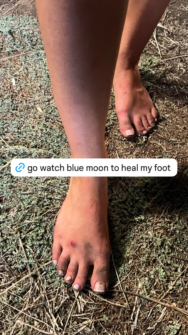 Zara Larsson showing bare feet on grass.
