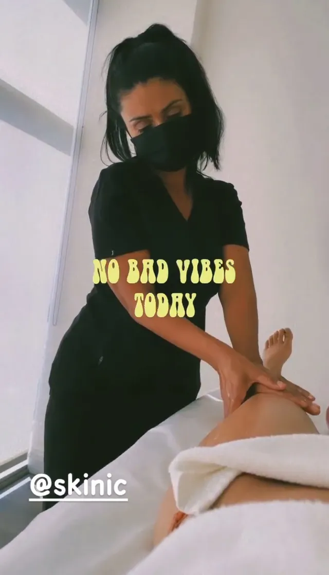 Emily Tosta having a bare foot treated.