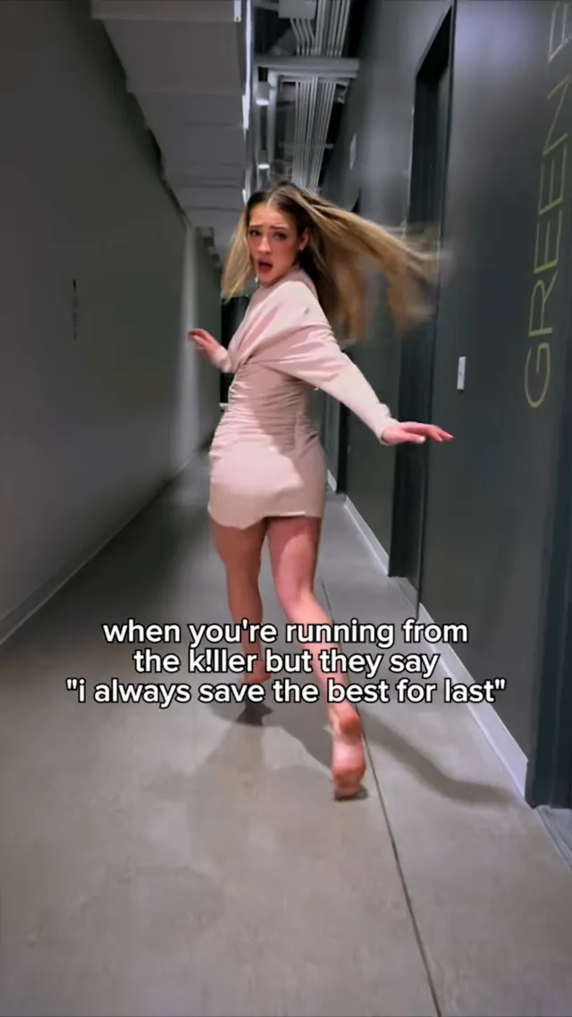 Madelyn Cline running barefoot along a corridor in a pale outfit.