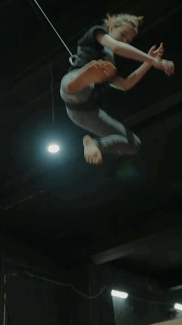 Emma Myers jumping barefoot during a training session.