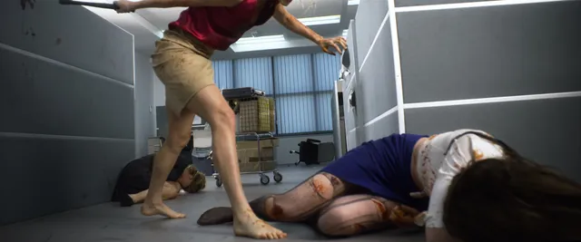 Samara Weaving walking barefoot beside a person on a floor in a film scene.