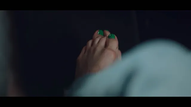 Bae Suzy showing painted toes in a scene.