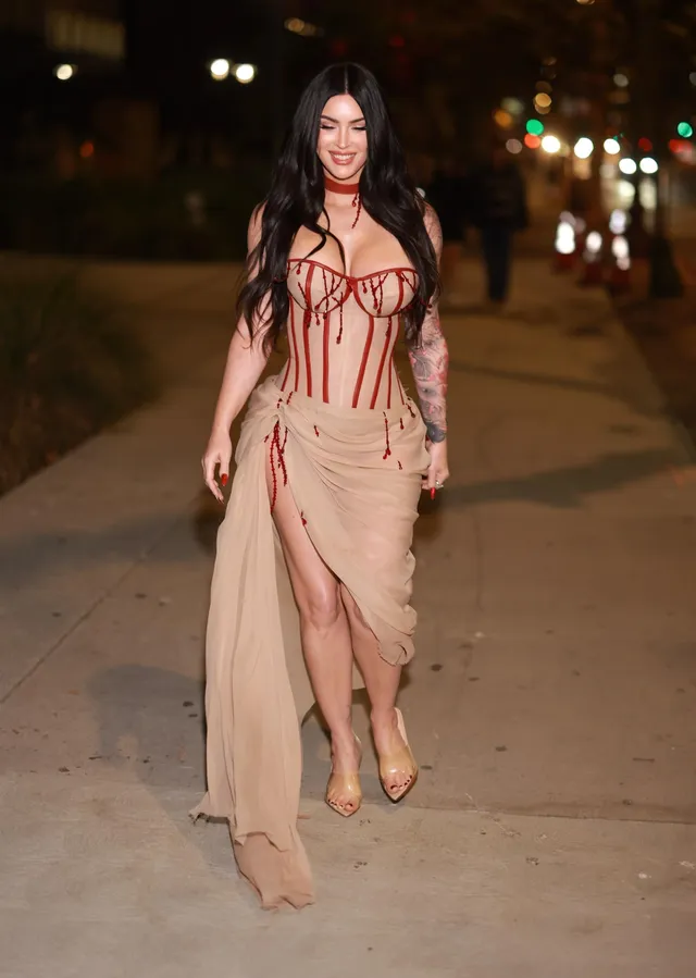 Megan Fox: walking barefoot outdoors in a pale dress.