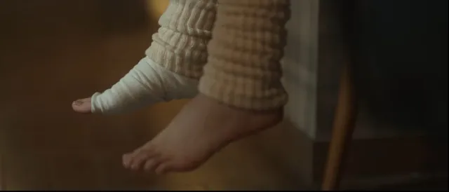 Bae Suzy showing a bare foot beneath checked trousers.