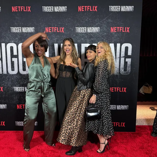 Teresa Palmer posing with cast members at a premiere.