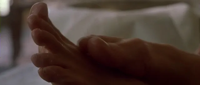 Angelina Jolie a close screen detail of bare toes.