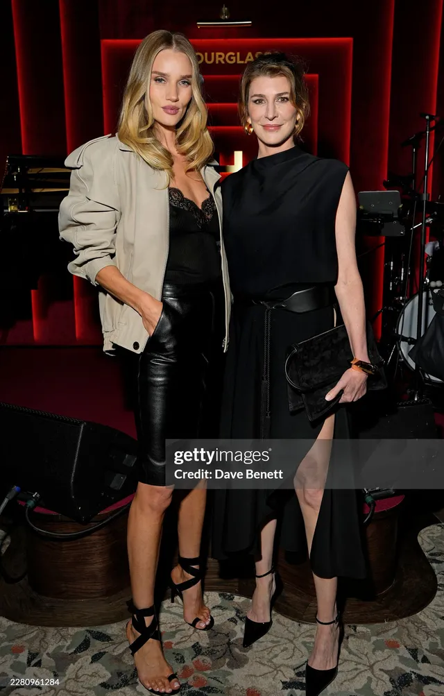 Rosie Huntington-Whiteley an evening event photograph in a pale jacket.