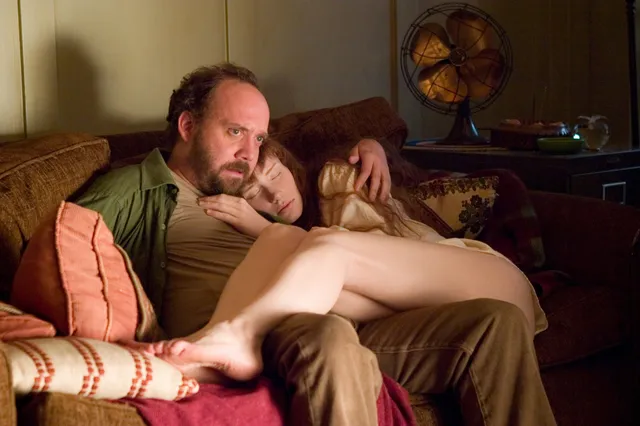 Bryce Dallas Howard reclining beside a companion during a screen scene.