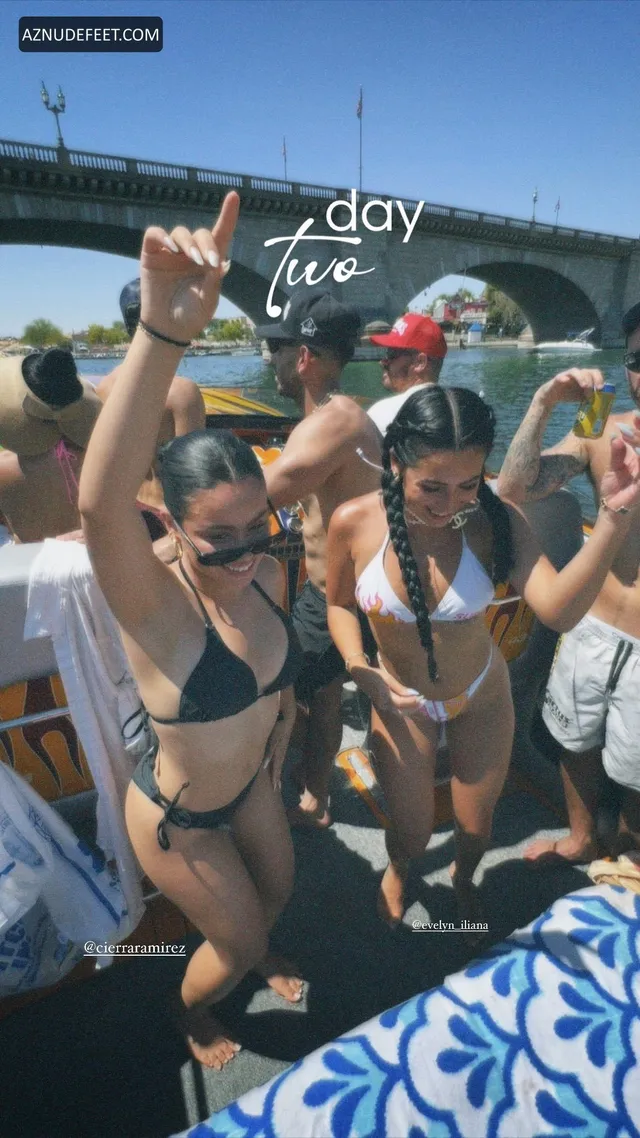 Cierra Ramirez in swimwear relaxing with friends beside a swimming pool.