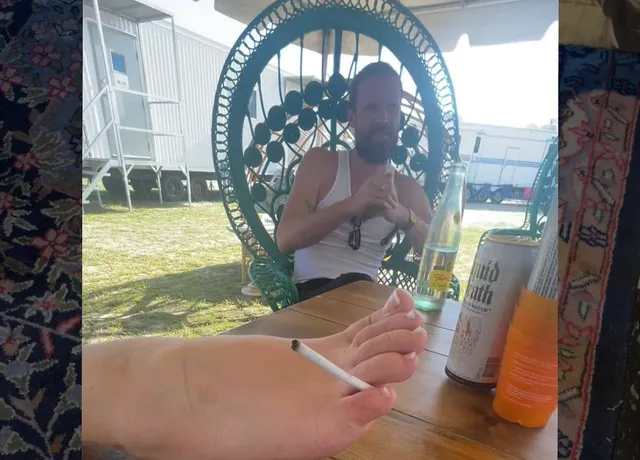 Lana Del Rey resting bare feet on an outdoor table.