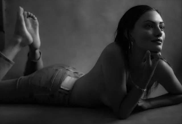 Phoebe Tonkin reclining for a black-and-white portrait.